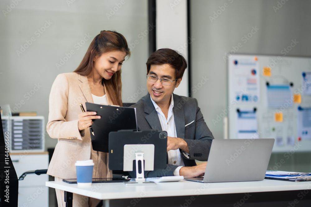Happy smiling businessman feel happy work complete Teamwork success, success at work in the office concept. Happy smiling businessman feel happy work complete Teamwork success, success at work in the office concept.