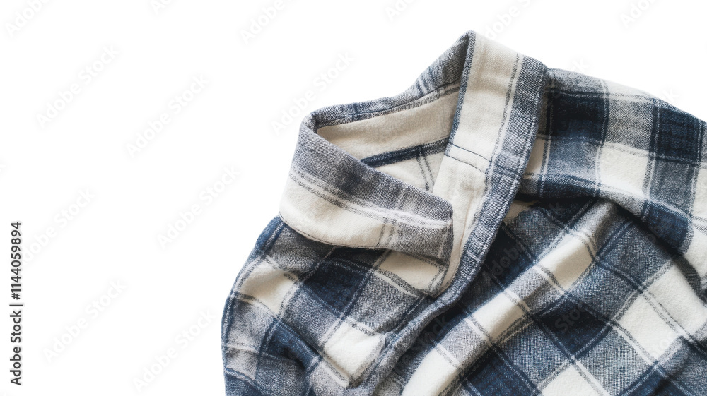 Soft flannel shirt laid flat on a surface, showcasing a stylish plaid pattern in blue and white colors during daylight hours. Soft flannel shirt laid flat on a surface, showcasing a stylish plaid pattern in blue and white colors during daylight hours.