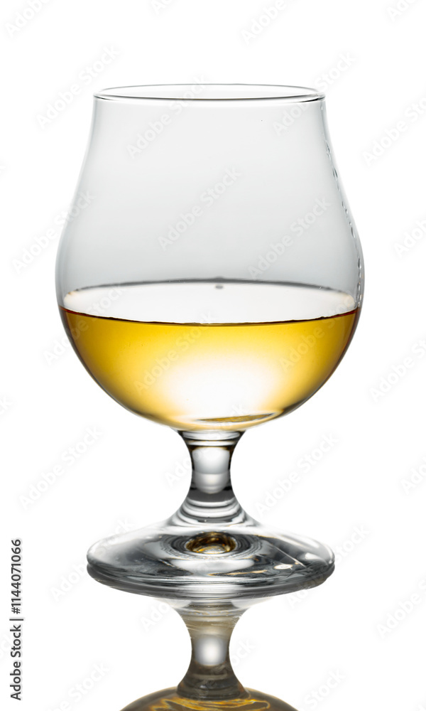 Brandy in a snifter on a white background. Brandy in a snifter on a white background.