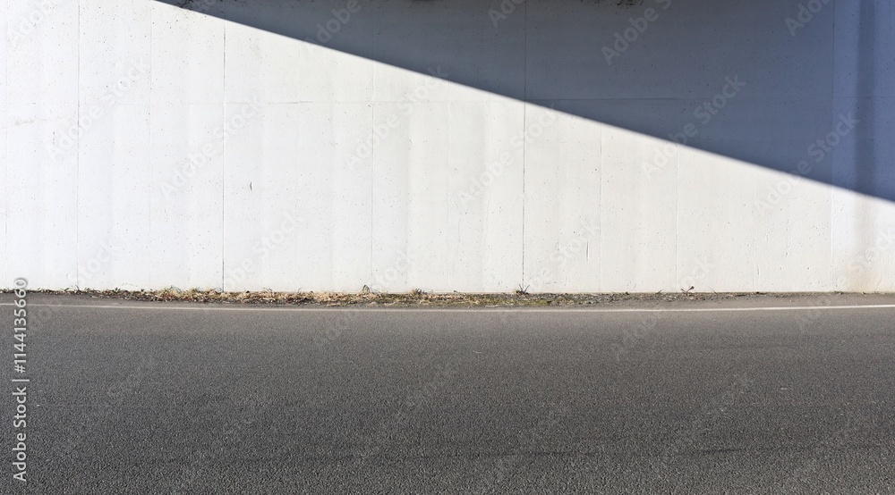 custom made wallpaper toronto digitalWhite prefab concrete wall divided by shadow and sunlight at the roadside. Street in front. Background for copy space
