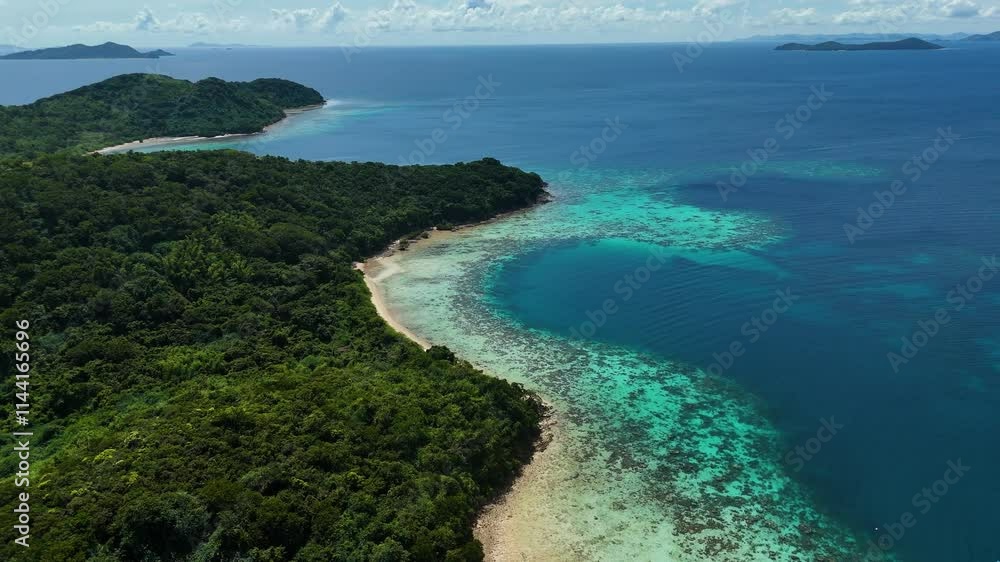 Aerial perspective of Bulog Dos Island, highlighting its serene beach and lush surroundings. Aerial perspective of Bulog Dos Island, highlighting its serene beach and lush surroundings.