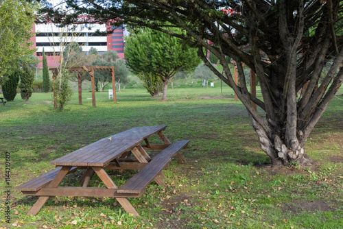 Picnic table inviting visitors to relax in loureshopping green park photo