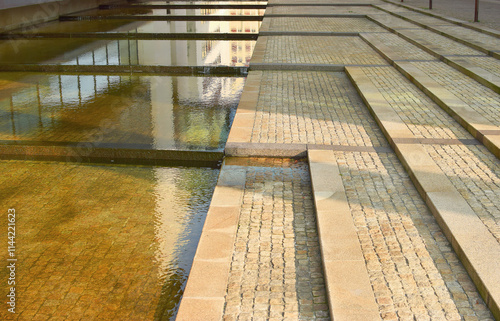 Decorative fountain with stone stairs and waterflow
