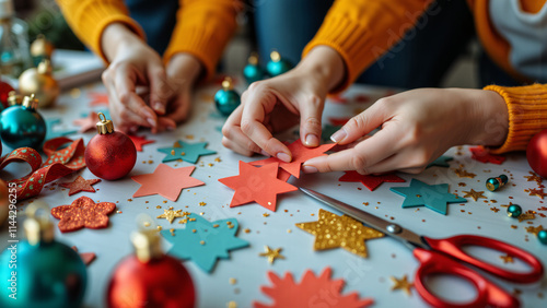 close-up of diy tabletop hands making decorations for holiday celebrations, showcasing creativity and personal touch in festive preparations.