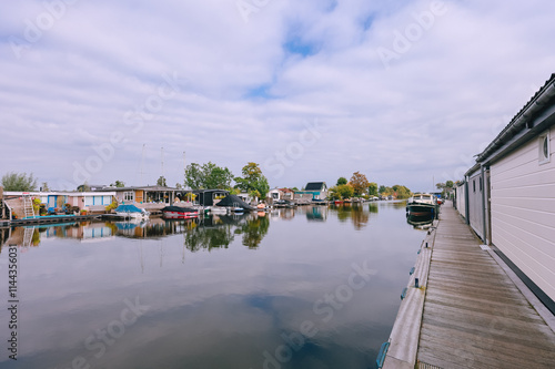 Houses on Loosdrechtse Plassen Lake with Boats, Islands and Canals. Scheendijk, Netherlands photo