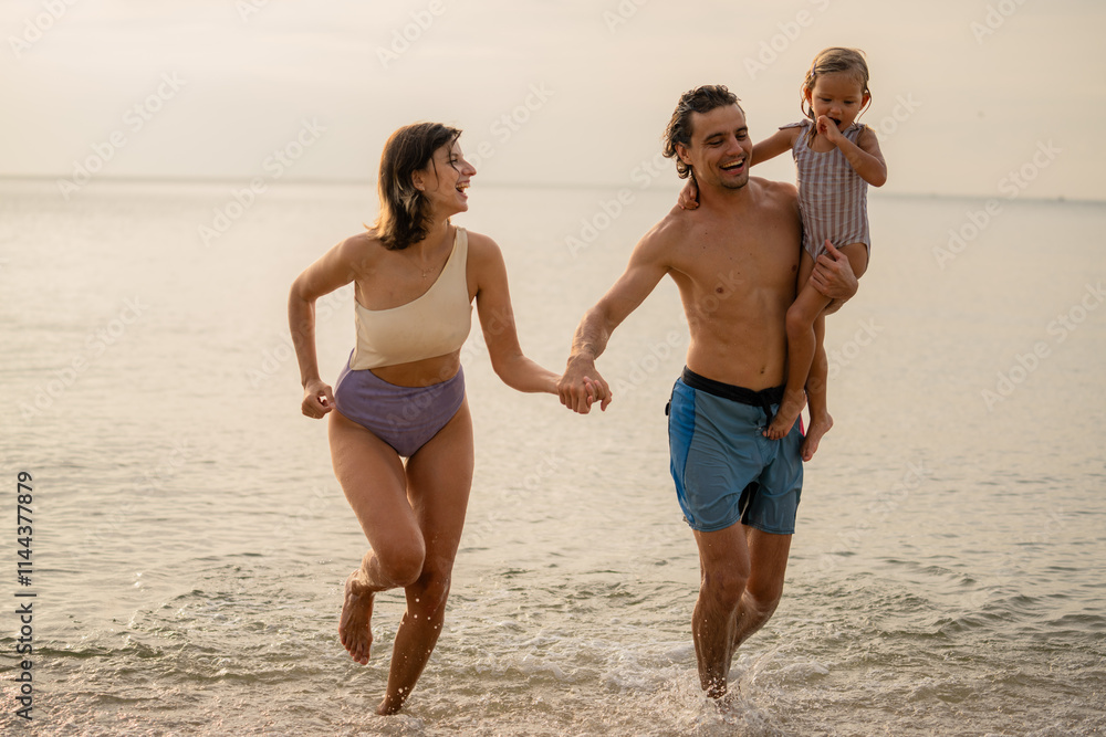 Happy family enjoying vacation on the beach together having fun on summer vacation. Happy family enjoying vacation on the beach together having fun on summer vacation.