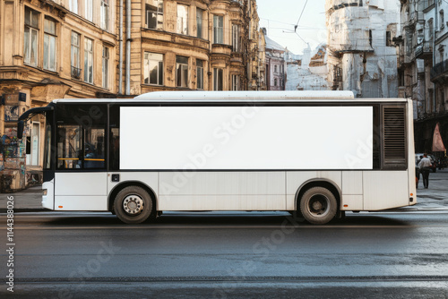 side view of the bus in the street with white mockup placment for branding or advertising  photo