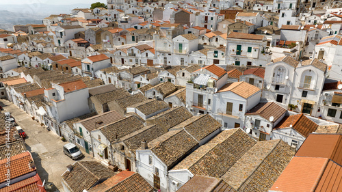 Aerial view of white houses, buildings and apartments in the historic center of Pisticci, in the province of Matera, Basilicata. It is a small hill town in southern Italy.