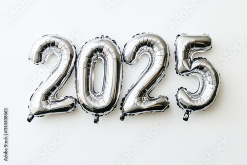 Silver foil balloons forming the number 2025 on a clean white background, symbolizing New Year and Christmas festivities