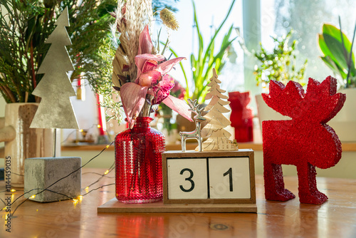 A beautifully decorated windowsill and interior in anticipation of Christmas and New Year celebrations. Symbols of the New Year and winter.