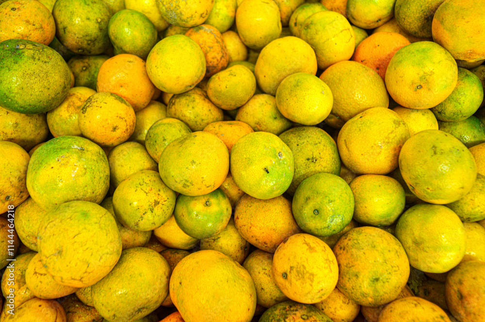 Orange citrus fruits in a fruit shop basket. Focus on fruit, noisy, exposure, similar others Orange citrus fruits in a fruit shop basket. Focus on fruit, noisy, exposure, similar others