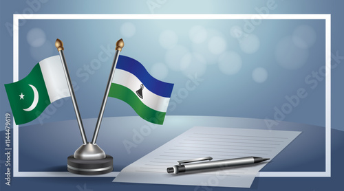 Pakistan and Lesotho National flags on small table with bokeh background, cooperative relationship
