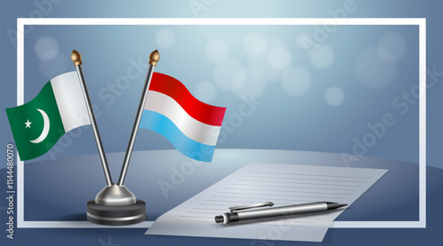Pakistan and Luxembourg National flags on small table with bokeh background, cooperative relationship