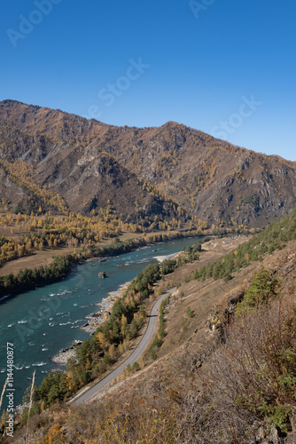 Beautiful autumn landscape, with a river and a road