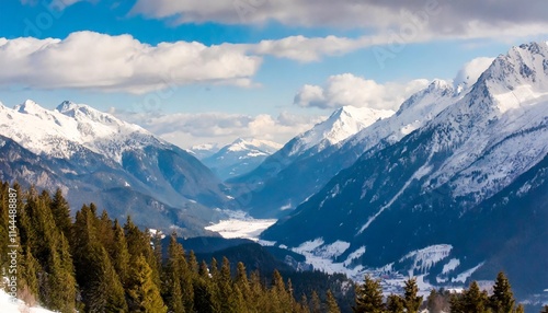 Majestic Snow-Capped Mountains with Pine Trees and a Dramatic Sky in Winter