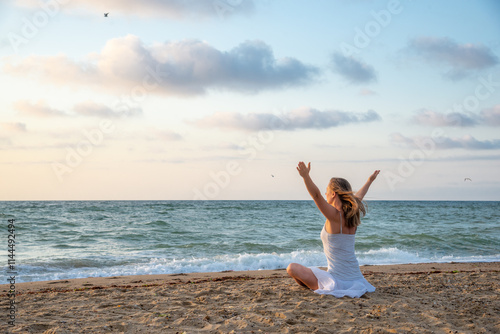 Woman meditating at the sea