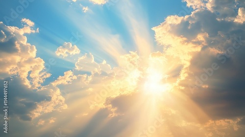 Fototapeta Naklejka Na Ścianę i Meble -  Soft beams of golden sunlight filtering through the clouds over a peaceful landscape