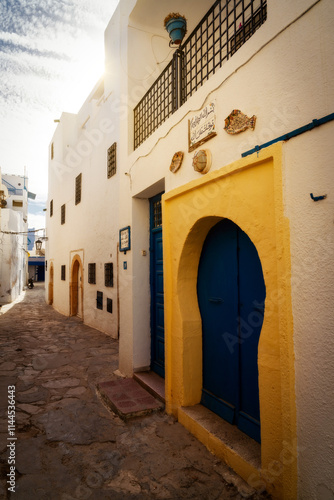 Obraz na płótnie Sidi Bou Said In Tunis, Tunesia (Text says: In the name of God, the world is at peace with God) w salonie