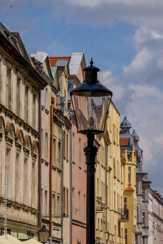 Fototapeta premium renovated old tenement houses in the city center. colorful buildings of old architecture in the city. residential houses after renovation.