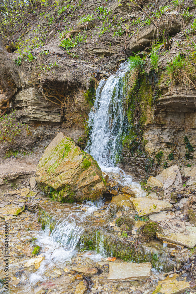 Fototapeta premium Slovenian keys or streams of the Twelve Apostles, natural and tourist object, Orthodox shrine. Russia, Pskov Region. Izborsk fortress. High quality photo