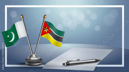 Pakistan and Mozambique National flags on small table with bokeh background, cooperative relationship