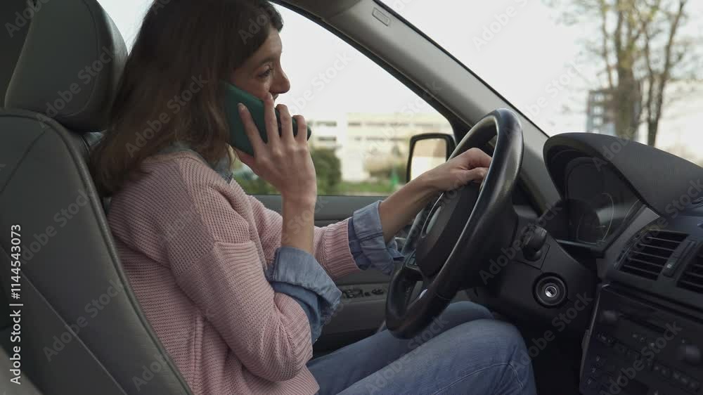 Woman driving car and talking on cell phone in slow motion. Woman driving car and talking on cell phone in slow motion.