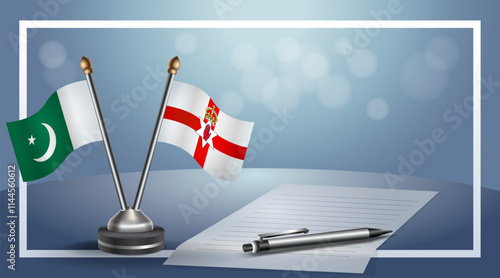 Pakistan and Northern Ireland National flags on small table with bokeh background, cooperative relationship