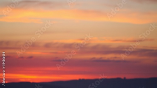 Abstract vivid sky at sunset with vibrant hues of pink, purple, and orange blending together seamlessly, nature, evening, tranquil