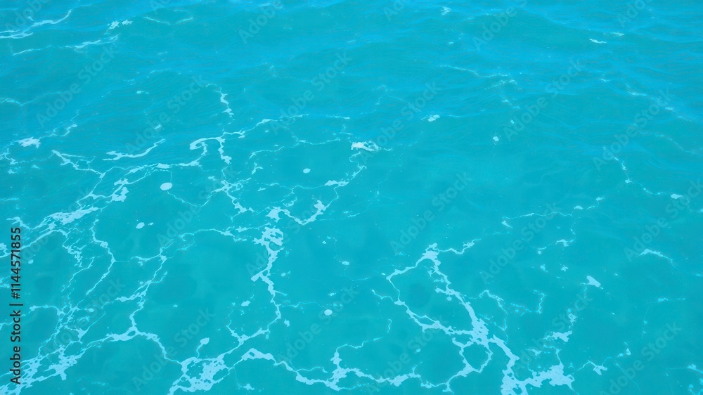 Blue turquoise ocean water with foamy waves creating a mesmerizing texture, water, sea Blue turquoise ocean water with foamy waves creating a mesmerizing texture, water, sea