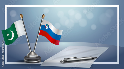 Pakistan and Slovenia National flags on small table with bokeh background, cooperative relationship