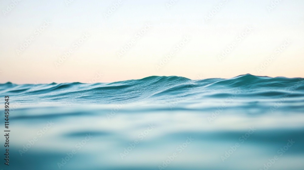 Gentle ocean waves rise and fall, creating a serene rhythm across calm turquoise waters under a pastel sky, capturing the peaceful essence of a tranquil sea at dawn. Gentle ocean waves rise and fall, creating a serene rhythm across calm turquoise waters under a pastel sky, capturing the peaceful essence of a tranquil sea at dawn.
