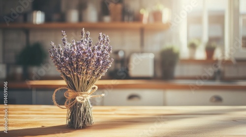 Obraz na płótnie A bunch of dried lavender tied with twine, resting on a wooden kitchen counter with soft natural light w salonie