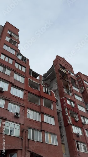 Russian missile hits residential building in Dnipro, Ukraine. Aftermath of enemy attack on city. Destroyed residential multi-story building. Close-up. War. Aftermath of explosion.