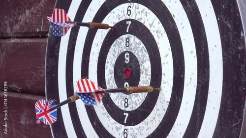 A close-up view of a dartboard with darts in the bullseye, highlighting the precision of the throws in 4k