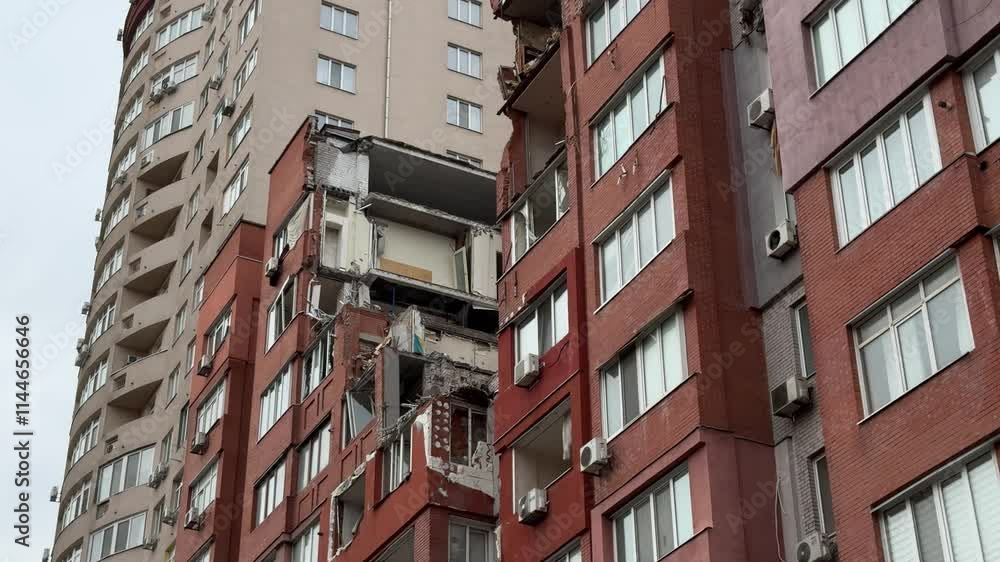 Russian missile hits residential building in Dnipro, Ukraine. Aftermath of enemy attack on city. Destroyed residential multi-story building. Close-up. War. Aftermath of explosion.