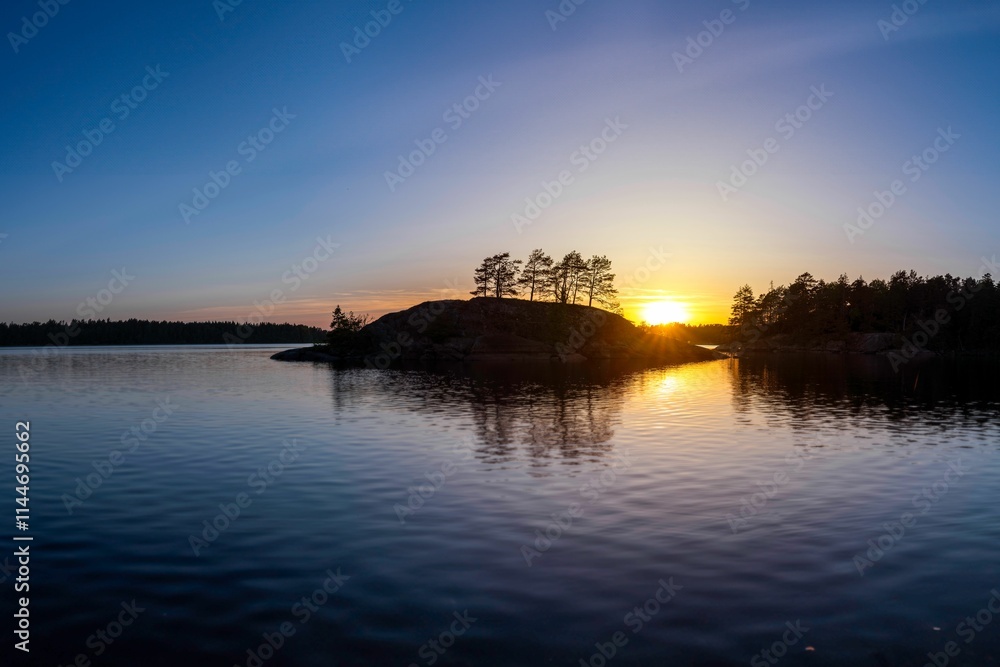 Sunset over tranquil lake with reflections. Sunset over tranquil lake with reflections.