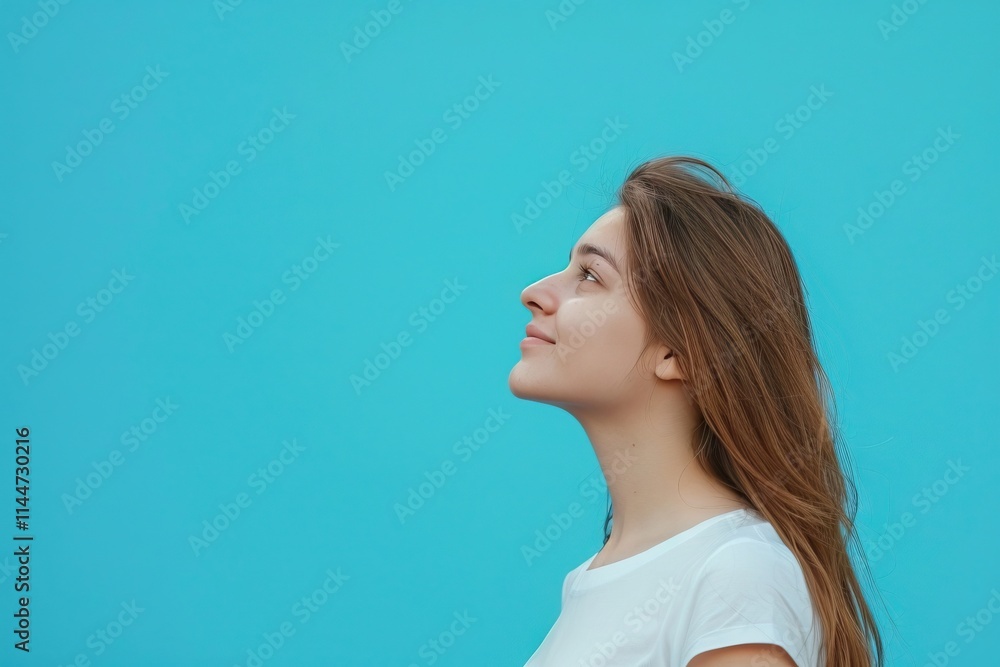 Attractive girl with copy space on blue background portrait. Attractive girl with copy space on blue background portrait.