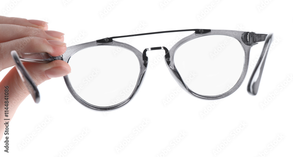 Woman holding glasses with stylish frame on white background, closeup Woman holding glasses with stylish frame on white background, closeup