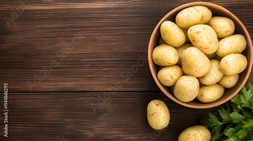 Delicious Bowl of Potato Salad on aWooden Table with Space for Copy photo