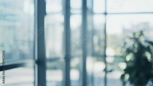 Blurred glass building with plant and natural light.