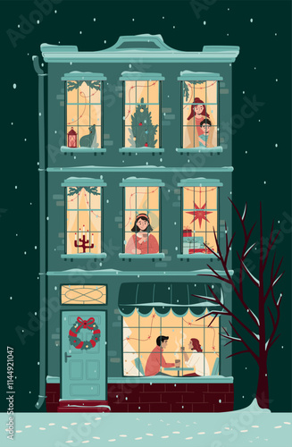 Cute Christmas house with windows decorated with lights and fir branches. People in the windows spending time at home and cafe at xmas eve. Snowfall, evening, warm Christmas atmosphere.