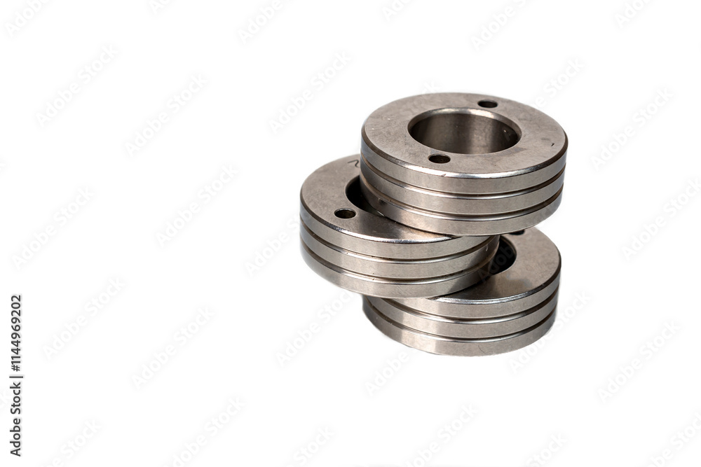 Set of metal washers on white background. Three round thick metal washers. industrial hardware for assembly and fastening. Set of metal washers on white background. Three round thick metal washers. industrial hardware for assembly and fastening.