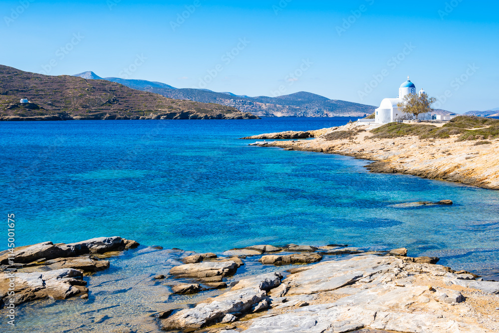 View of rocky coast with beach and Agios Panteleemon chapel, Amorgos island, Cyclades, Greece