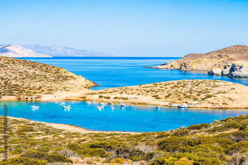 Boats in sea bay of Kalotaritissa with beautiful sandy beach, Amorgos island, Cyclades, Greece
