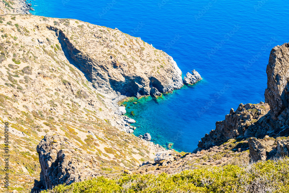 View of sea bay with beach and high cliffs, Amorgos island, Cyclades, Greece