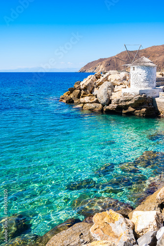 Windmill in port of Aigiali (Ormos Egialis), Amorgos island, Cyclades, Greece photo