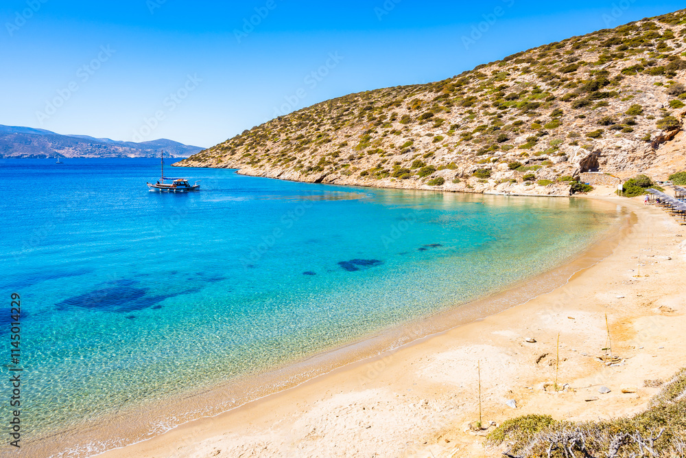 Amazing Maltezi bay and beach with fishing boat on sea, Amorgos island, Cyclades, Greece