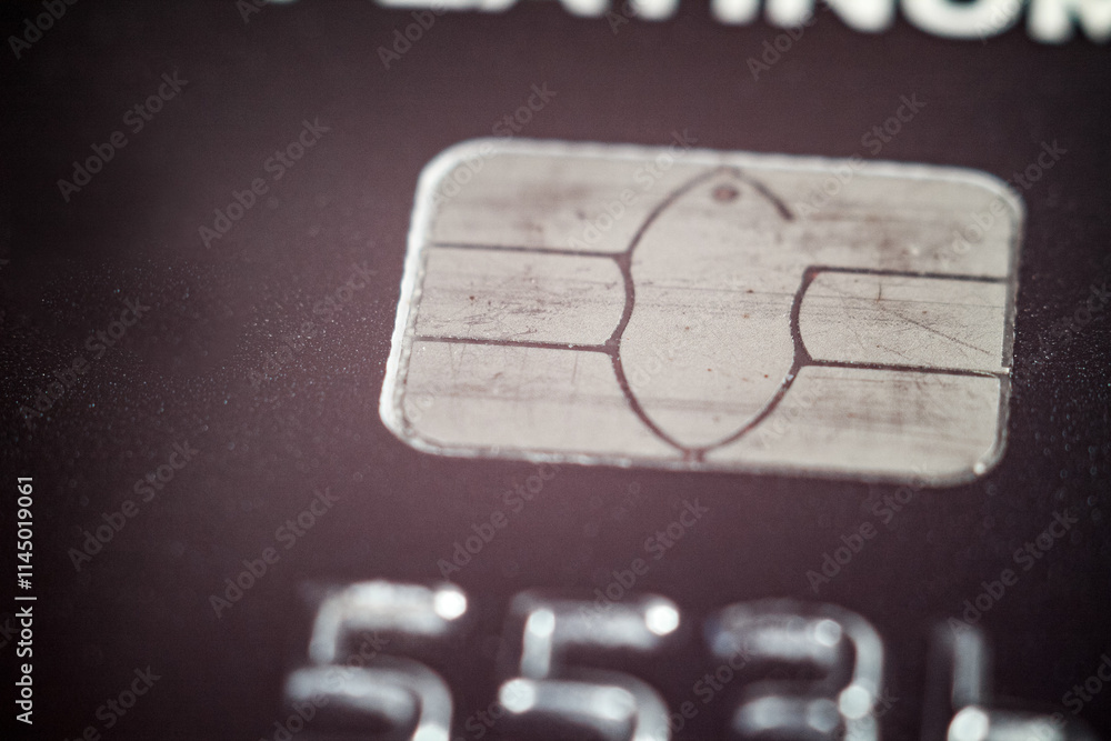 Close-up of a bank card chip demonstrating contactless payment Close-up of a bank card chip demonstrating contactless payment