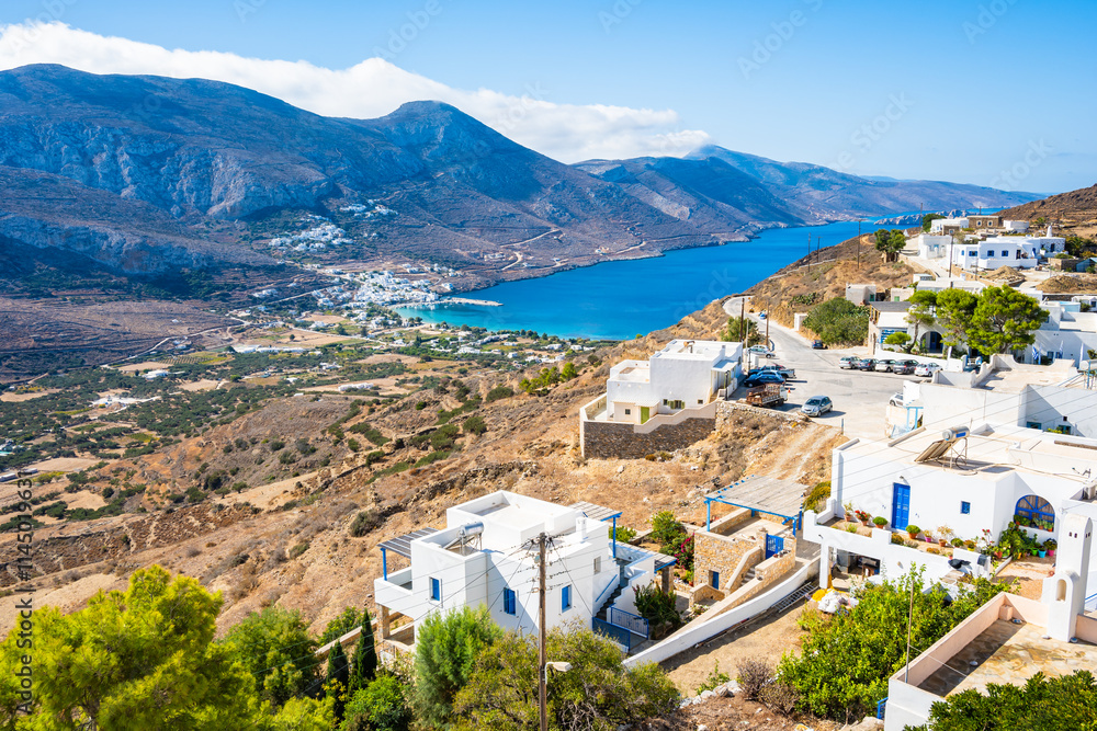 View of Tholaria village with Aigiali sea bay and mountains in distance, Amorgos island, Cyclades, Greece