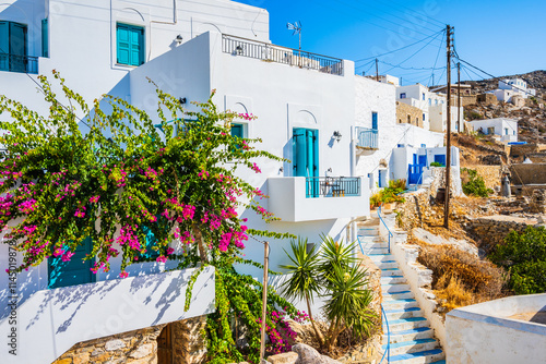 Obraz na płótnie Typical traditional white houses in Tholaria village decorated with bougainvillea flowers, Amorgos island, Cyclades, Greece w salonie